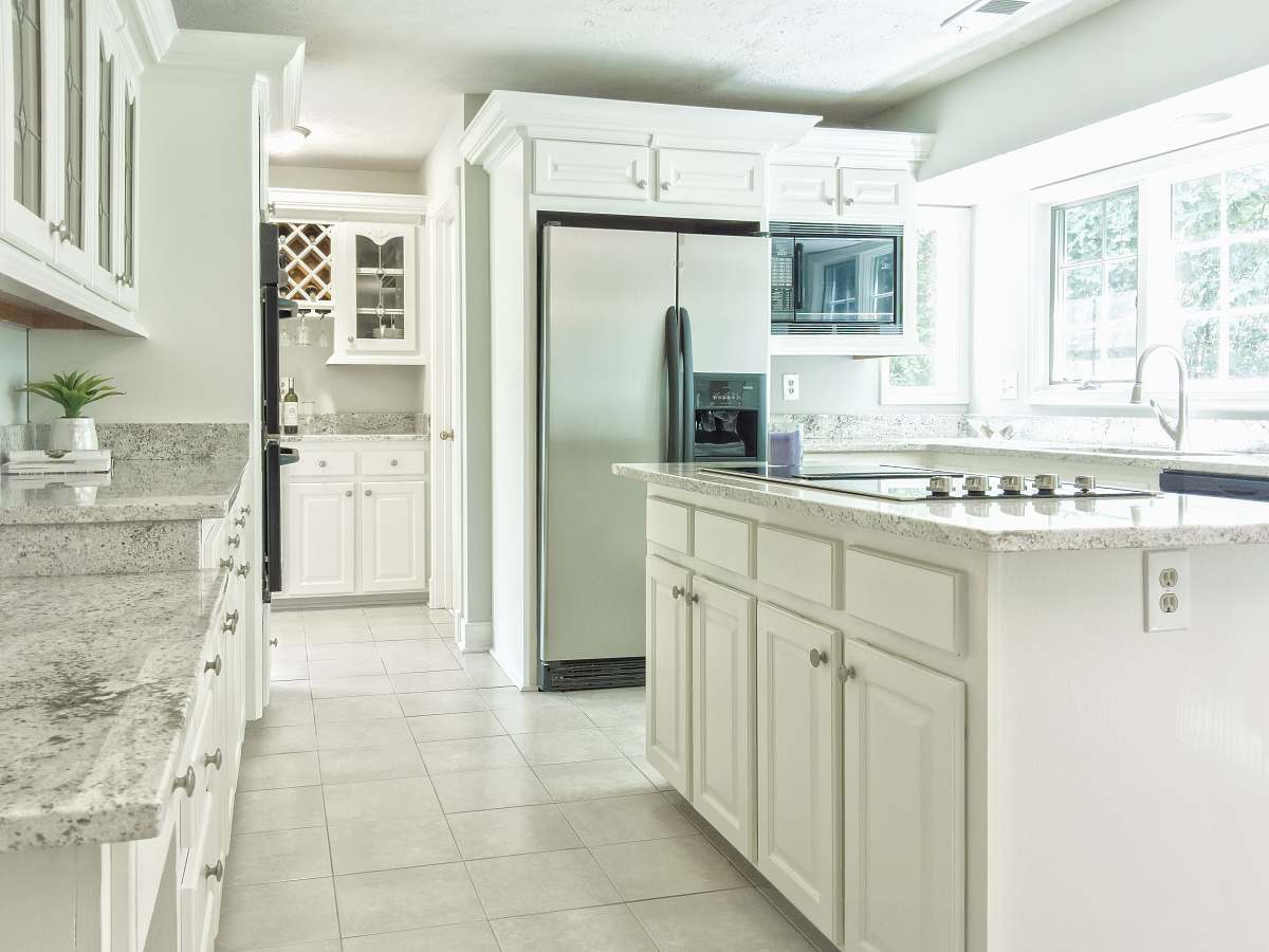 potomac falls white wooden kitchen cabinet near white wooden door va